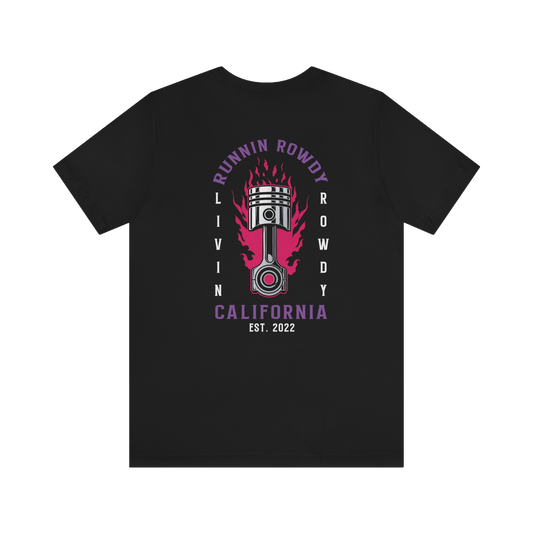 RUNNIN ROWDY CALIFORNIA in purple text surrounding a firey piston in center of shirt. LIVIN ROWDY displayed on sides of piston